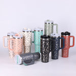 40oz insulated stainless steel tumbler with comfortable handle and reusable straw.