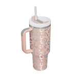 40oz insulated cup keeping smoothie cold at the beach on a sunny summer day.
