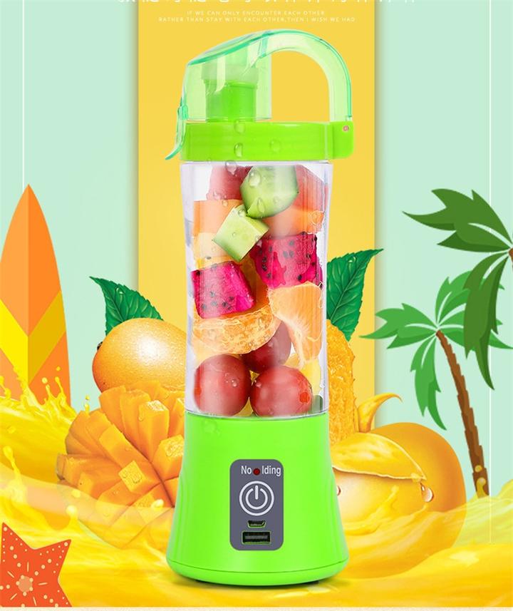 Single-serve cordless travel blender sitting next to a gym bag and workout towel