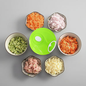 Compact pull-string vegetable chopper packed for outdoor camping, RV trips, and off-grid meal prep.