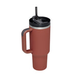 Tapered bottom design of 40oz tumbler sliding smoothly into a vehicle cupholder.
