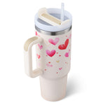 Close-up of tumbler handle, straw, and spill-proof lid
