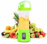 Portable smoothie blender plugged into a laptop via USB charging cable